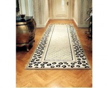 The rug in the hallway incorporated the patterns on those in the living and dining areas. Its blended design makes it a statement piece. It is important to ensure that the design in linking areas such as hallways keep to theme of the actual rooms so cohesion is achieved.